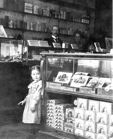 First drug store before the fire.  Dorothy, John and Jo Corskie. Harrison Idaho
